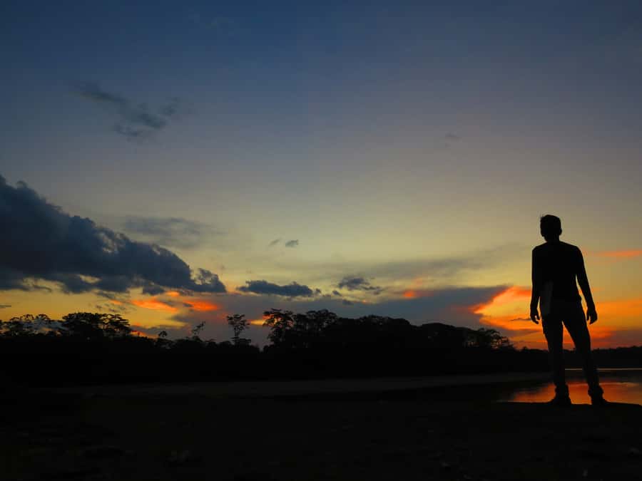 Capibara and caiman search on the Tambopata river - Why the Tambopata sunset works so well