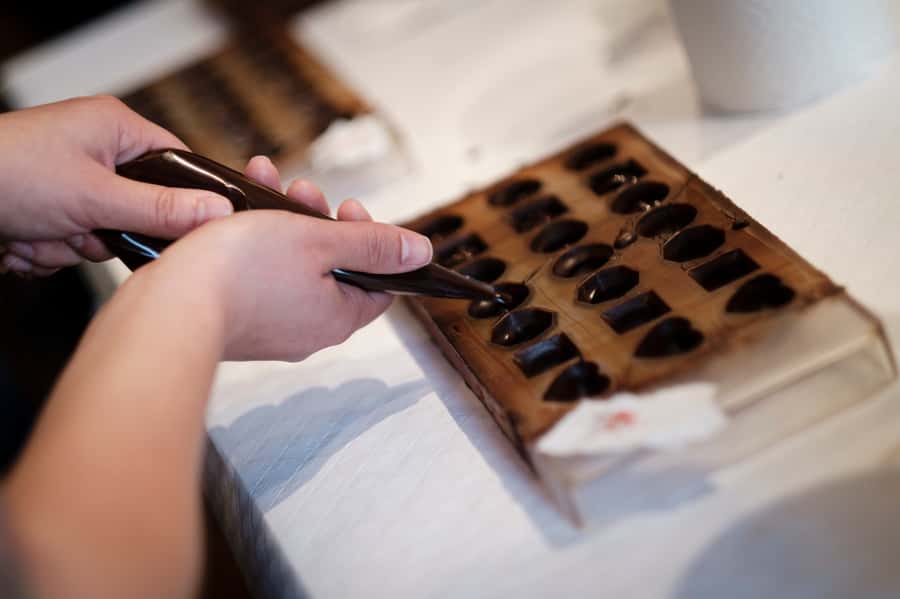 Cusco: Chocolate Workshop with the Best Local Organic Cacao - Melting and tempering the chocolate