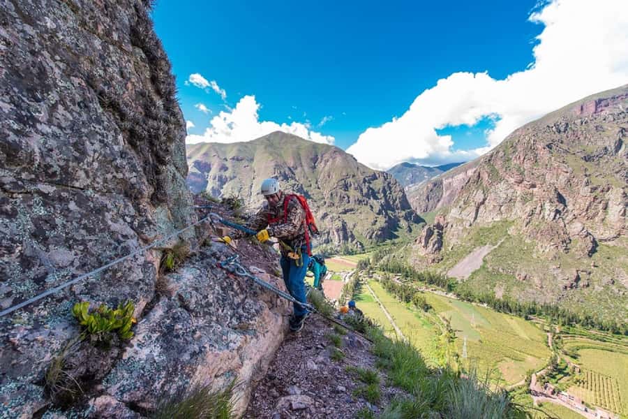 From Cusco: Via Ferrata & Zip Line with lunch - Starting the Via Ferrata on Pachar’s rock wall