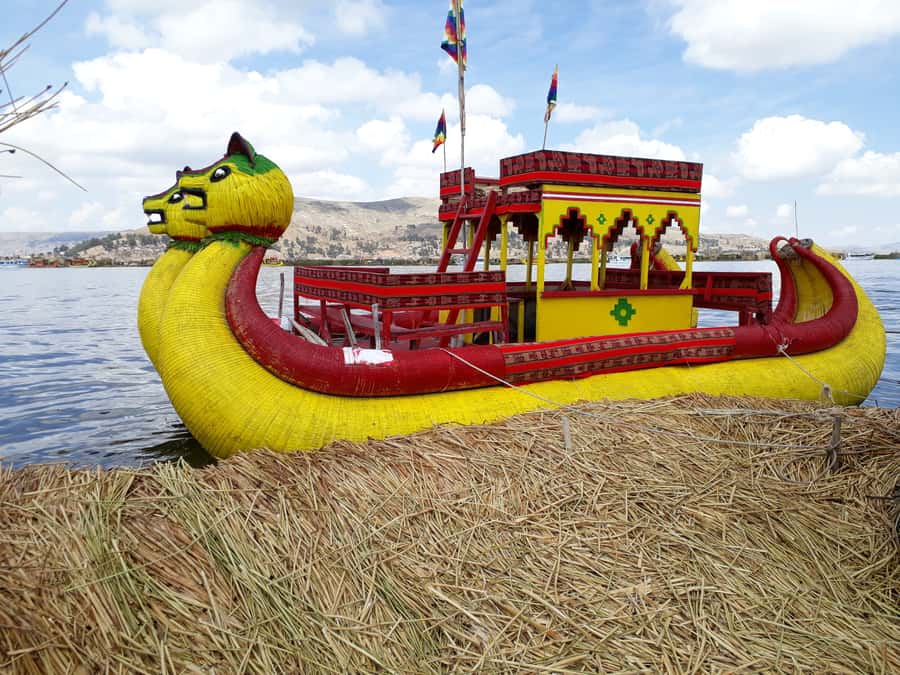 From Puno: Floating Islands of the Uros Half-Day Tour - Stepping onto a totora island