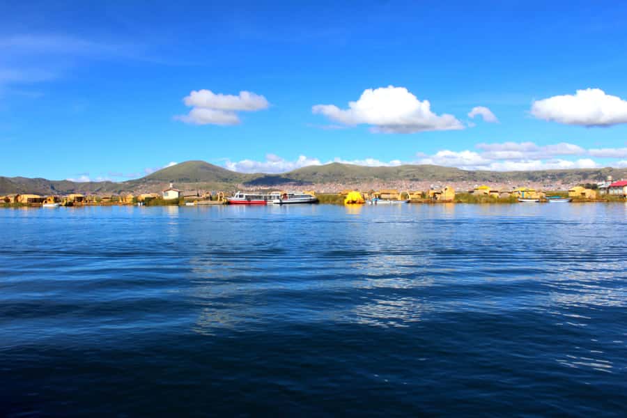 From Puno: Uros floating islands half Day tour - The optional handmade boat ride