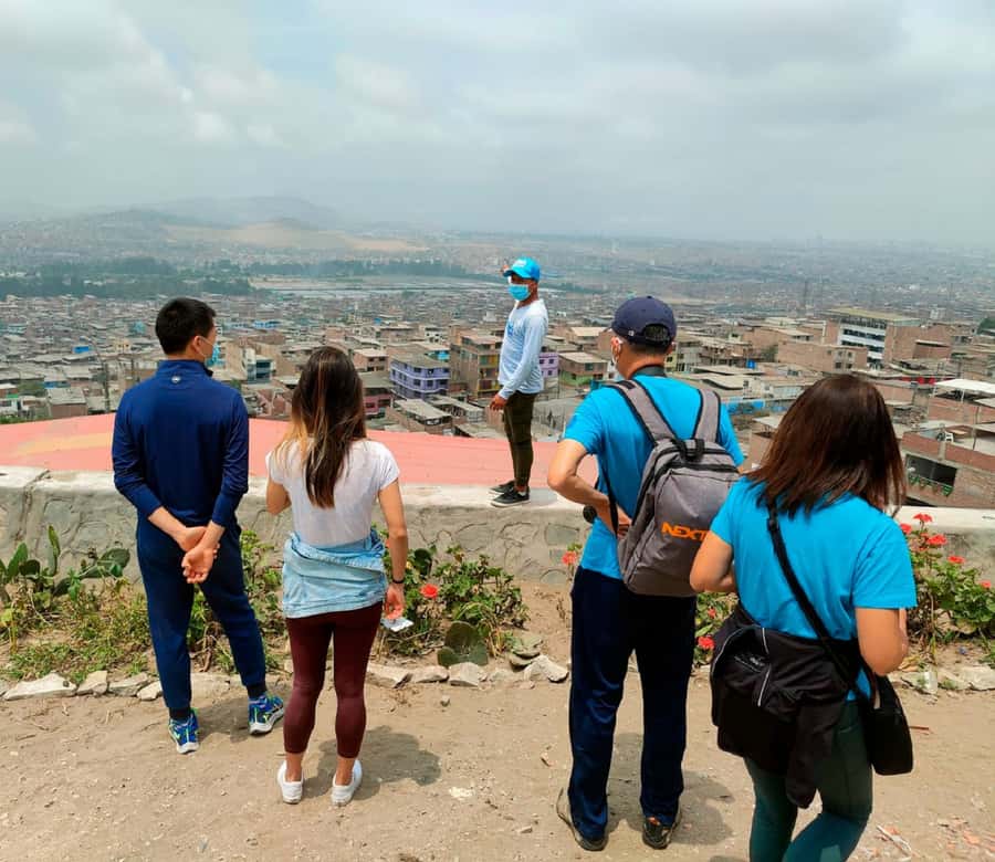 Lima: Villa El Salvador Shanty Town Tour - Yellow stairs and the climb up the hill
