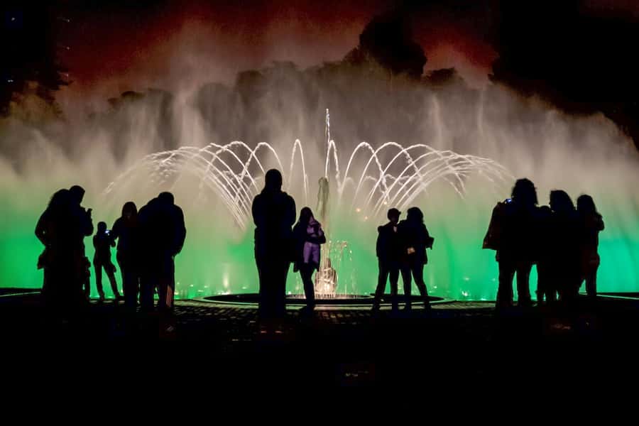 Lima: Water Magic Circuit, Downtown and Catacombs Night Tour - Lima’s Main Square after sunset