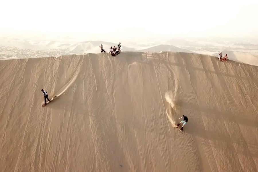 Nasca: Ocongalla Aqueduct Sandboarding in the Usaka desert - The profaned cemetery and the cost of looting