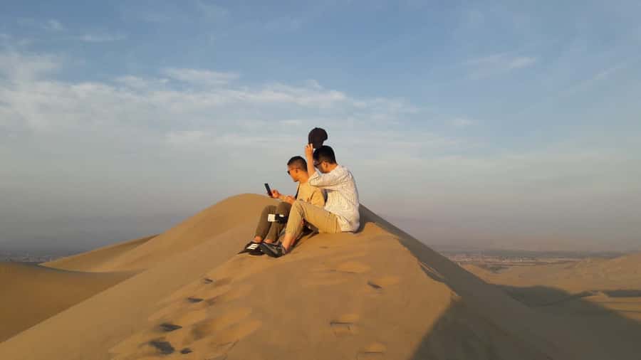Paracas or Pisco: Private Huacachina Oasis Tour & Buggy Ride - Sandboarding and the climb to the highest dune