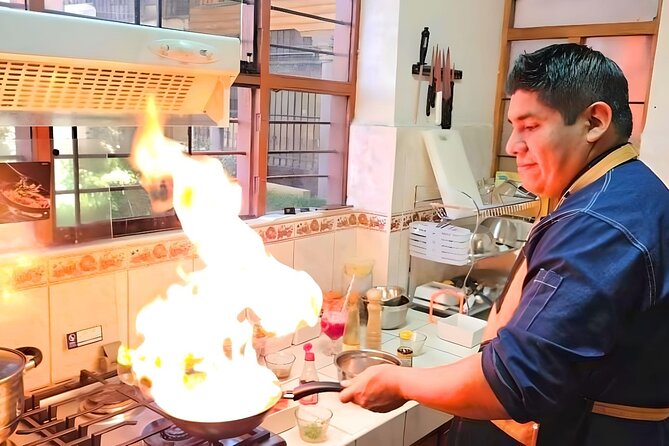 Vegan Peruvian Cooking Class Cocktails and Local Market in Cusco - From market produce to a central cooking studio